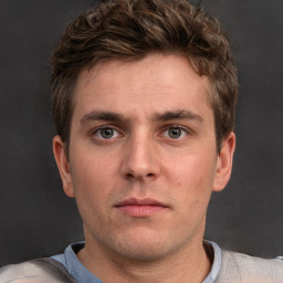 Neutral white young-adult male with short  brown hair and grey eyes