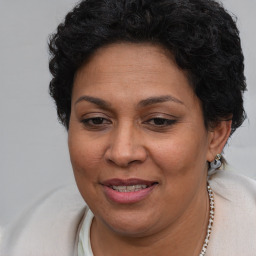 Joyful white adult female with short  brown hair and brown eyes