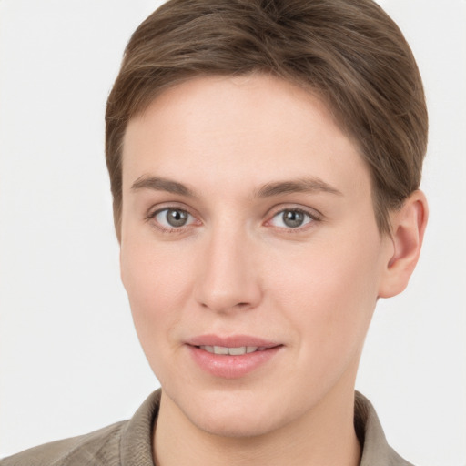 Joyful white young-adult female with short  brown hair and grey eyes