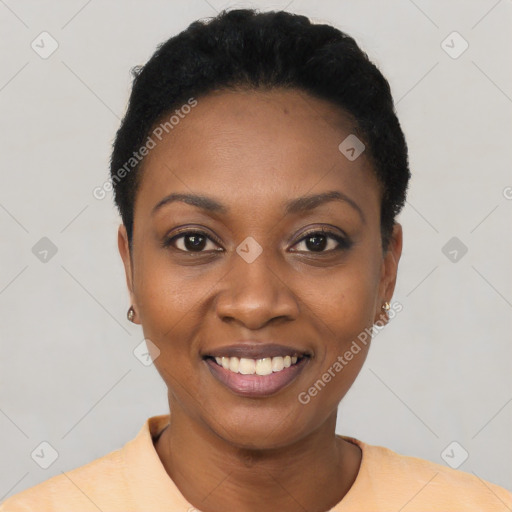 Joyful black young-adult female with short  black hair and brown eyes