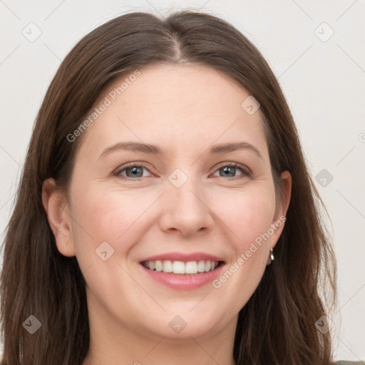 Joyful white young-adult female with long  brown hair and grey eyes