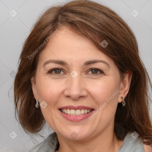 Joyful white adult female with medium  brown hair and brown eyes