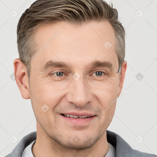 Joyful white adult male with short  brown hair and grey eyes