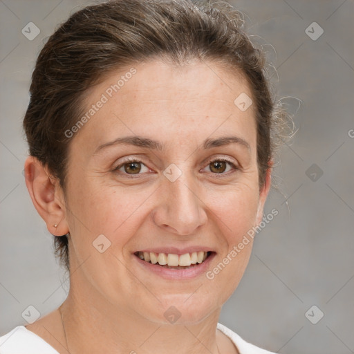 Joyful white adult female with short  brown hair and grey eyes