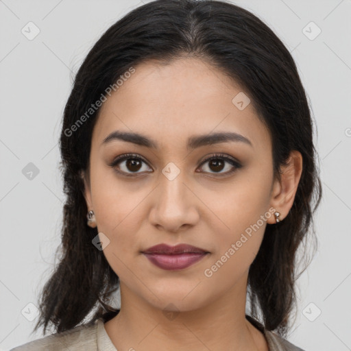 Joyful latino young-adult female with medium  brown hair and brown eyes