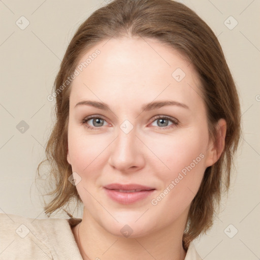 Joyful white young-adult female with medium  brown hair and green eyes