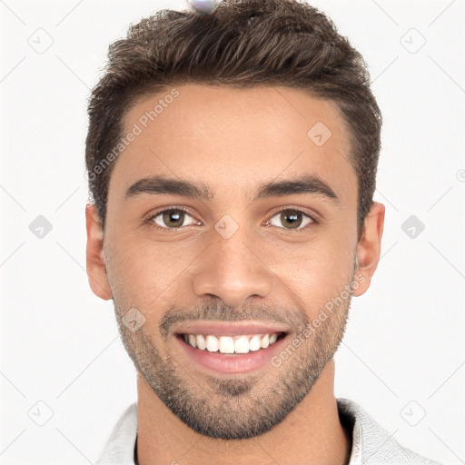 Joyful white young-adult male with short  black hair and brown eyes