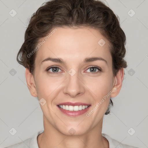 Joyful white young-adult female with short  brown hair and grey eyes