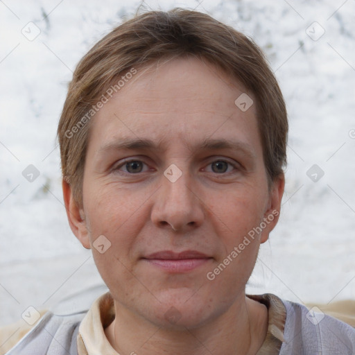 Joyful white adult female with short  brown hair and brown eyes