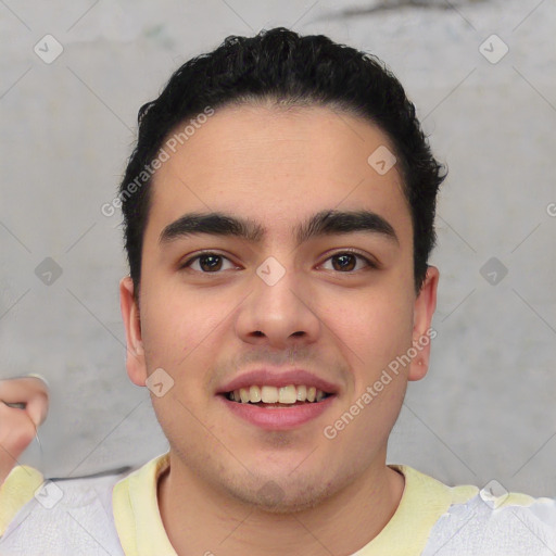 Joyful white young-adult male with short  black hair and brown eyes