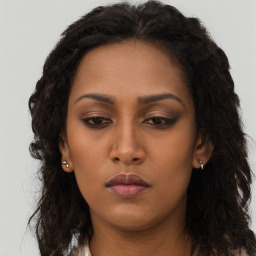 Neutral black young-adult female with long  brown hair and brown eyes