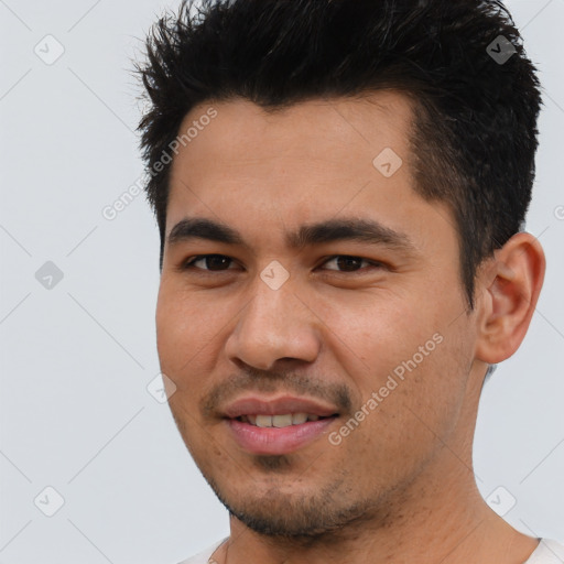 Joyful asian young-adult male with short  black hair and brown eyes