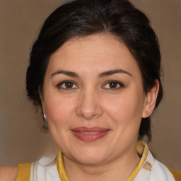 Joyful white adult female with medium  brown hair and brown eyes