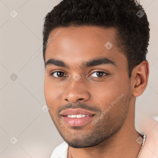 Joyful black young-adult male with short  black hair and brown eyes