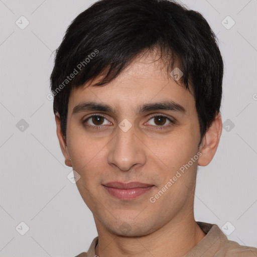 Joyful white young-adult male with short  black hair and brown eyes