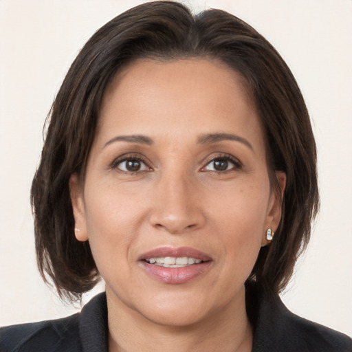 Joyful white adult female with medium  brown hair and brown eyes