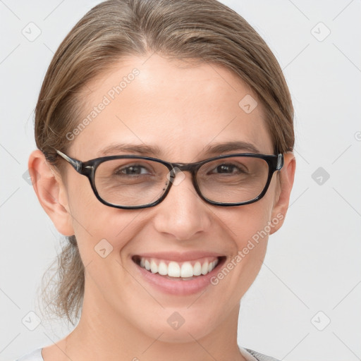 Joyful white young-adult female with medium  brown hair and brown eyes