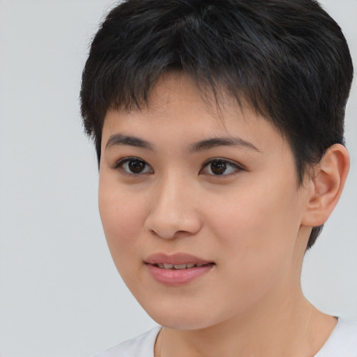Joyful asian young-adult female with short  brown hair and brown eyes
