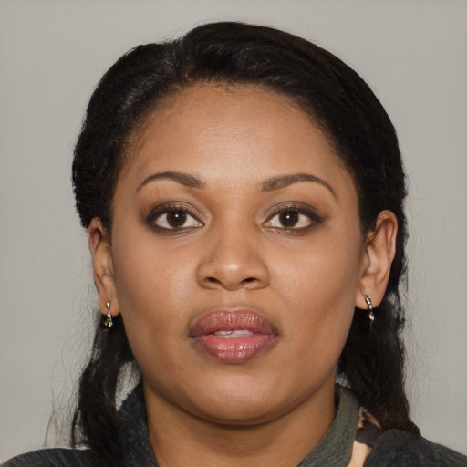 Joyful latino young-adult female with medium  black hair and brown eyes