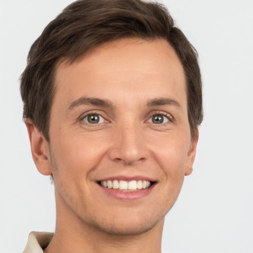 Joyful white young-adult male with short  brown hair and brown eyes