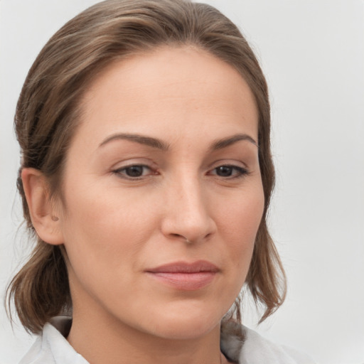 Joyful white young-adult female with medium  brown hair and brown eyes