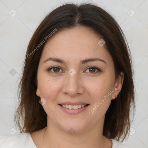 Joyful white adult female with medium  brown hair and brown eyes