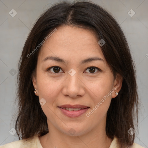 Joyful white adult female with medium  brown hair and brown eyes