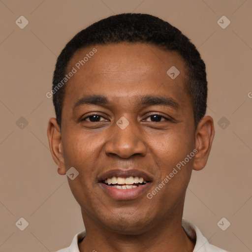 Joyful black young-adult male with short  black hair and brown eyes