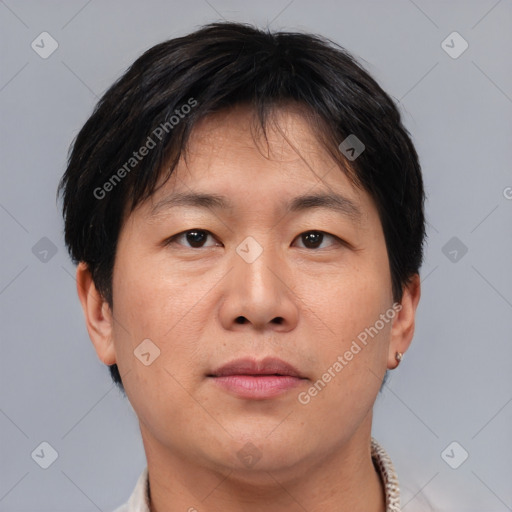 Neutral asian adult male with short  brown hair and brown eyes