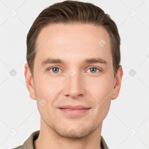 Joyful white young-adult male with short  brown hair and grey eyes