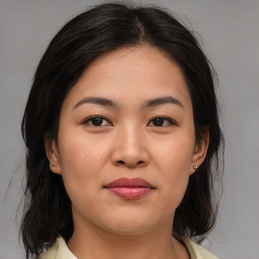 Joyful asian young-adult female with medium  brown hair and brown eyes