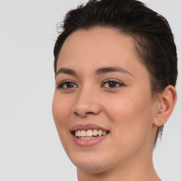 Joyful white young-adult female with medium  brown hair and brown eyes