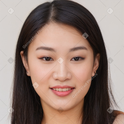 Joyful asian young-adult female with long  brown hair and brown eyes