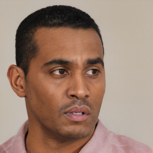 Neutral black young-adult male with short  black hair and brown eyes