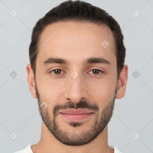 Joyful white young-adult male with short  black hair and brown eyes