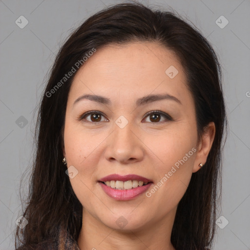 Joyful latino young-adult female with medium  brown hair and brown eyes