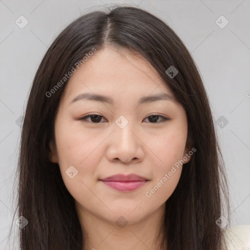 Joyful asian young-adult female with long  brown hair and brown eyes