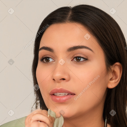 Neutral white young-adult female with long  brown hair and brown eyes