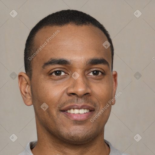 Joyful latino young-adult male with short  brown hair and brown eyes