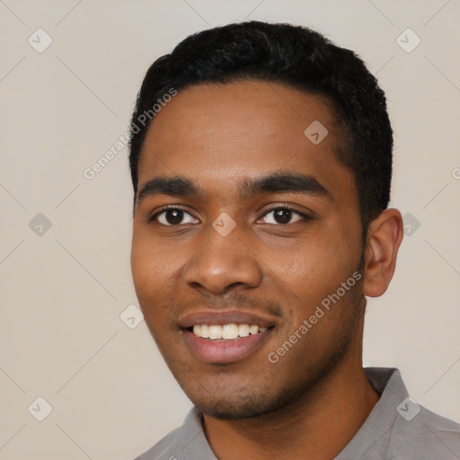 Joyful black young-adult male with short  black hair and brown eyes