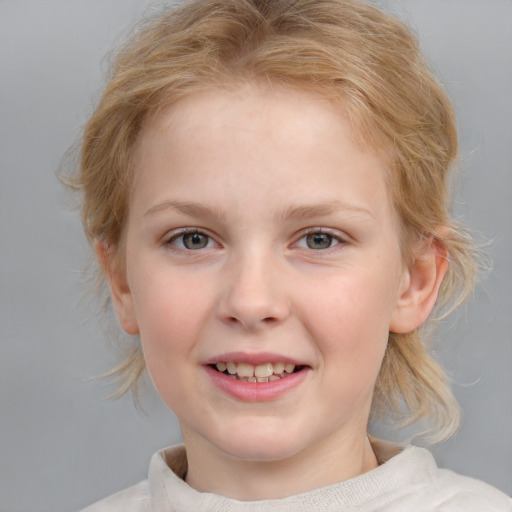 Joyful white child female with medium  blond hair and blue eyes