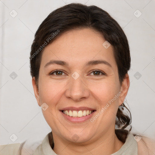 Joyful white adult female with short  brown hair and brown eyes