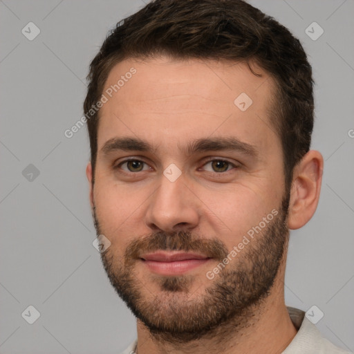 Joyful white young-adult male with short  brown hair and brown eyes