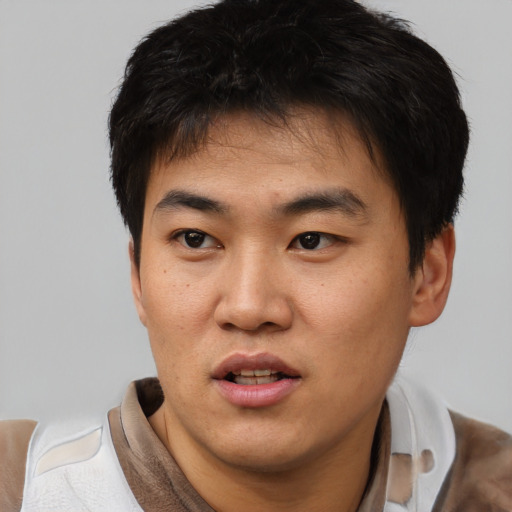 Neutral asian young-adult male with short  black hair and brown eyes