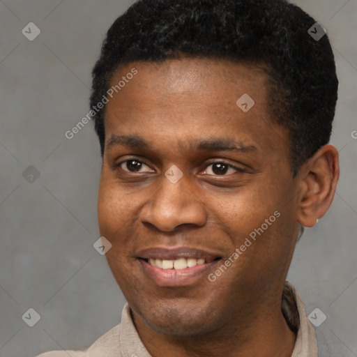 Joyful black young-adult male with short  black hair and brown eyes