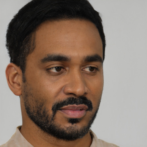 Neutral black young-adult male with short  black hair and brown eyes
