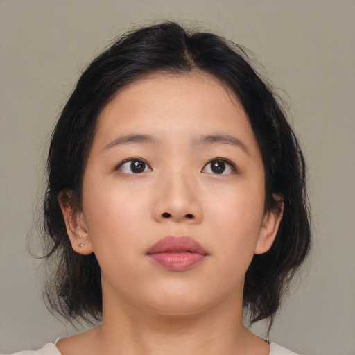 Neutral asian young-adult female with medium  brown hair and brown eyes