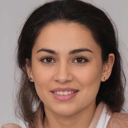 Joyful white young-adult female with medium  brown hair and brown eyes