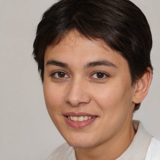 Joyful white young-adult female with short  brown hair and brown eyes
