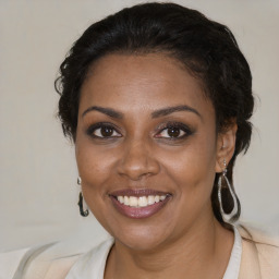 Joyful black young-adult female with medium  brown hair and brown eyes